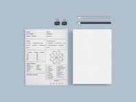 a white paper, pencil, and a piece of paper on a blue surface